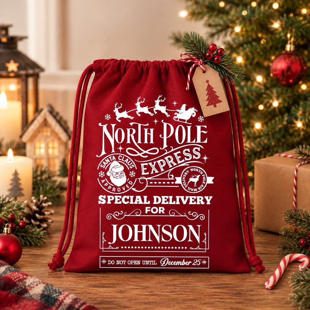 A red Santa Claus-themed gift bag with a Christmas tree and other holiday decorations in the background.